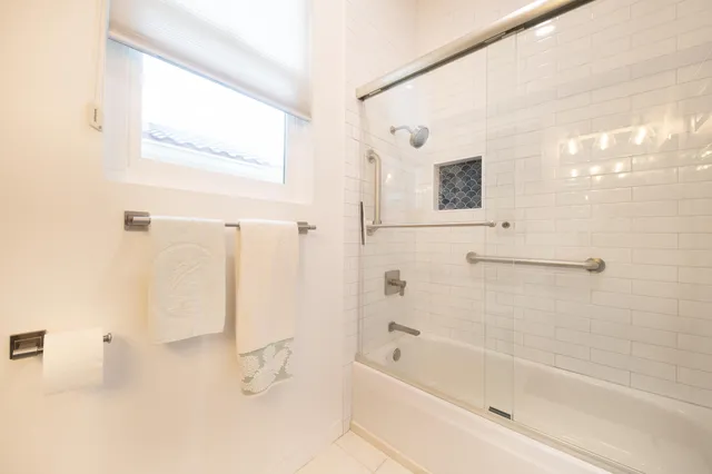 a bathroom with a bathtub and a shower