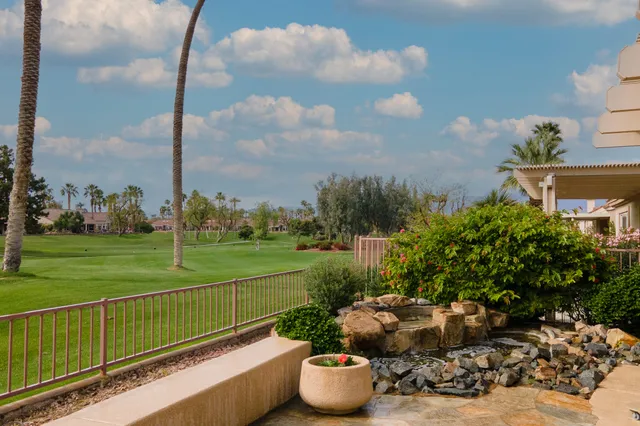 a garden view with a fountain