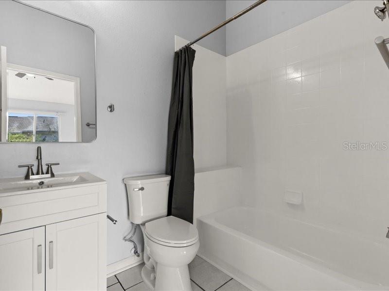 29924 Playa Del Rey Lane Wesley Chapel, FL 33543 - Photo 15 of 31 a bathroom with a sink toilet and shower