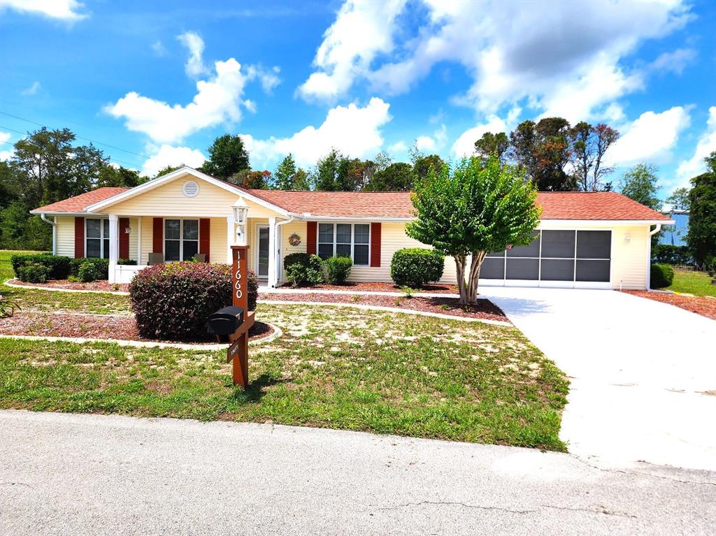 11660 Southwest 89th Terrace Ocala, FL 34481 - Photo 1 of 16 a front view of a house with a yard