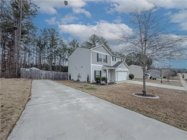a view of a house with a street