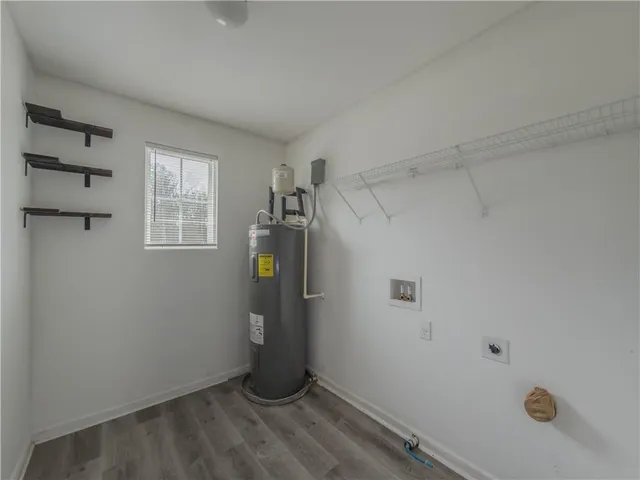a view of a storage & utility room with a window