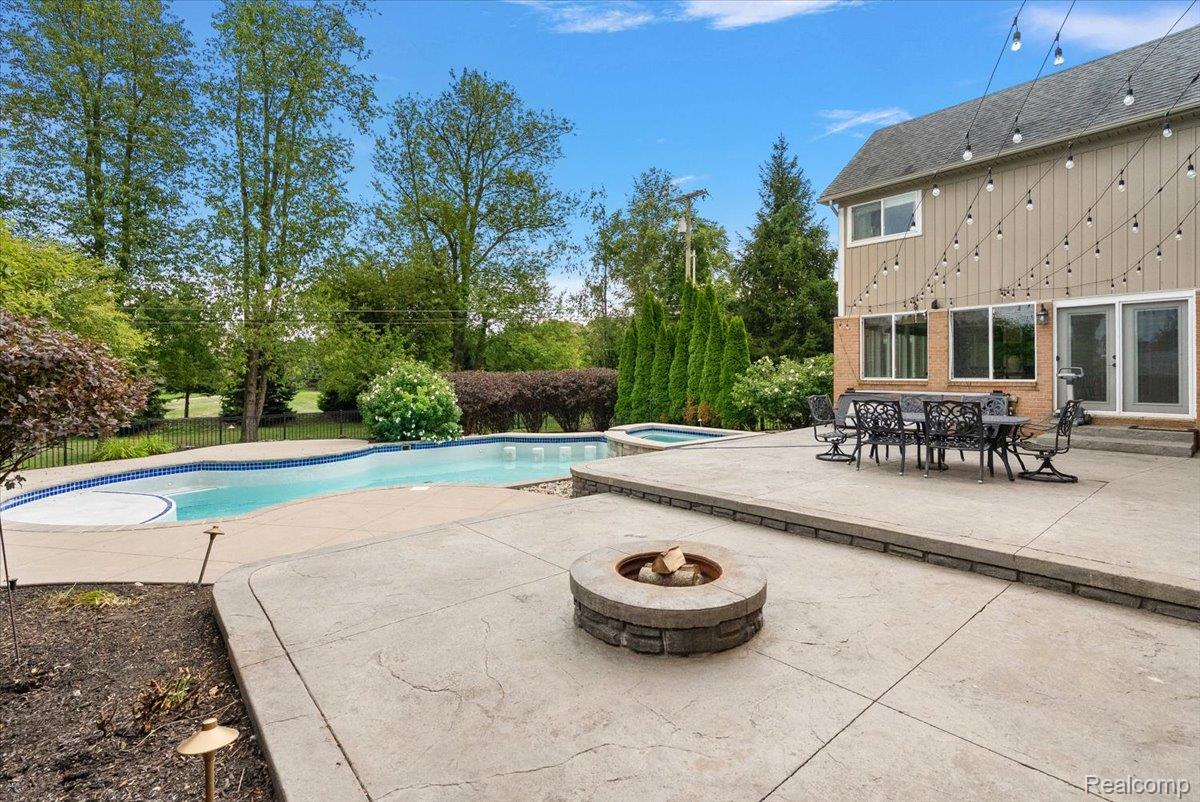 62650 Mound Road Washington, MI 48094 - Photo 60 of 76 Two-tier patio with built-in fire pit