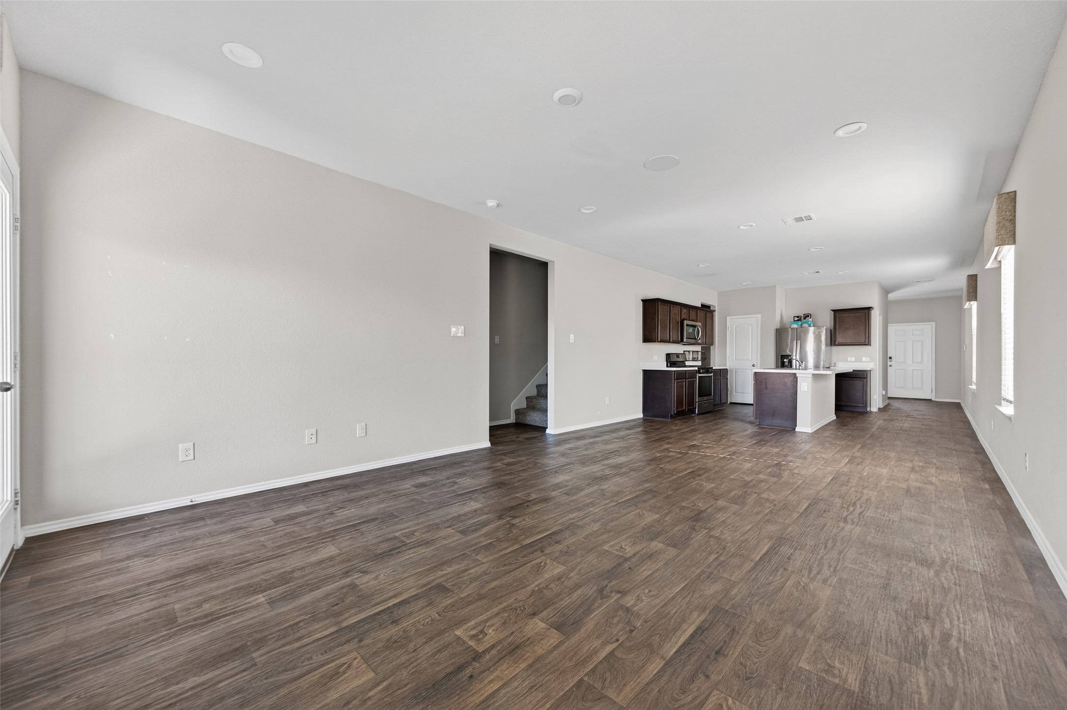 14432 Sugar Pines Drive Conroe, TX 77302 - Photo 11 of 26 a view of empty room with wooden floor
