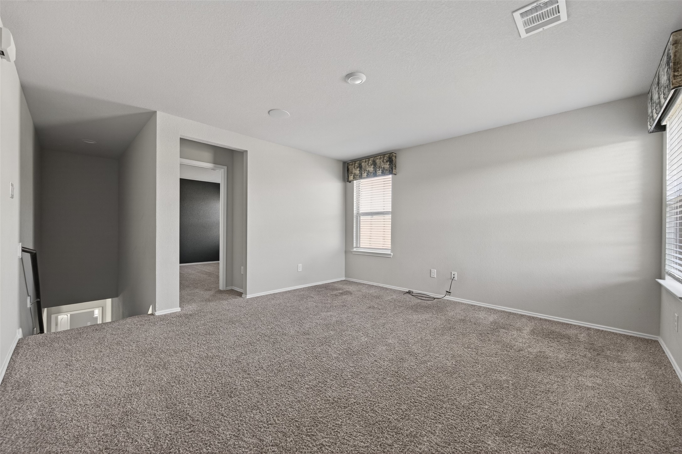 14432 Sugar Pines Drive Conroe, TX 77302 - Photo 18 of 26 a view of an empty room with window