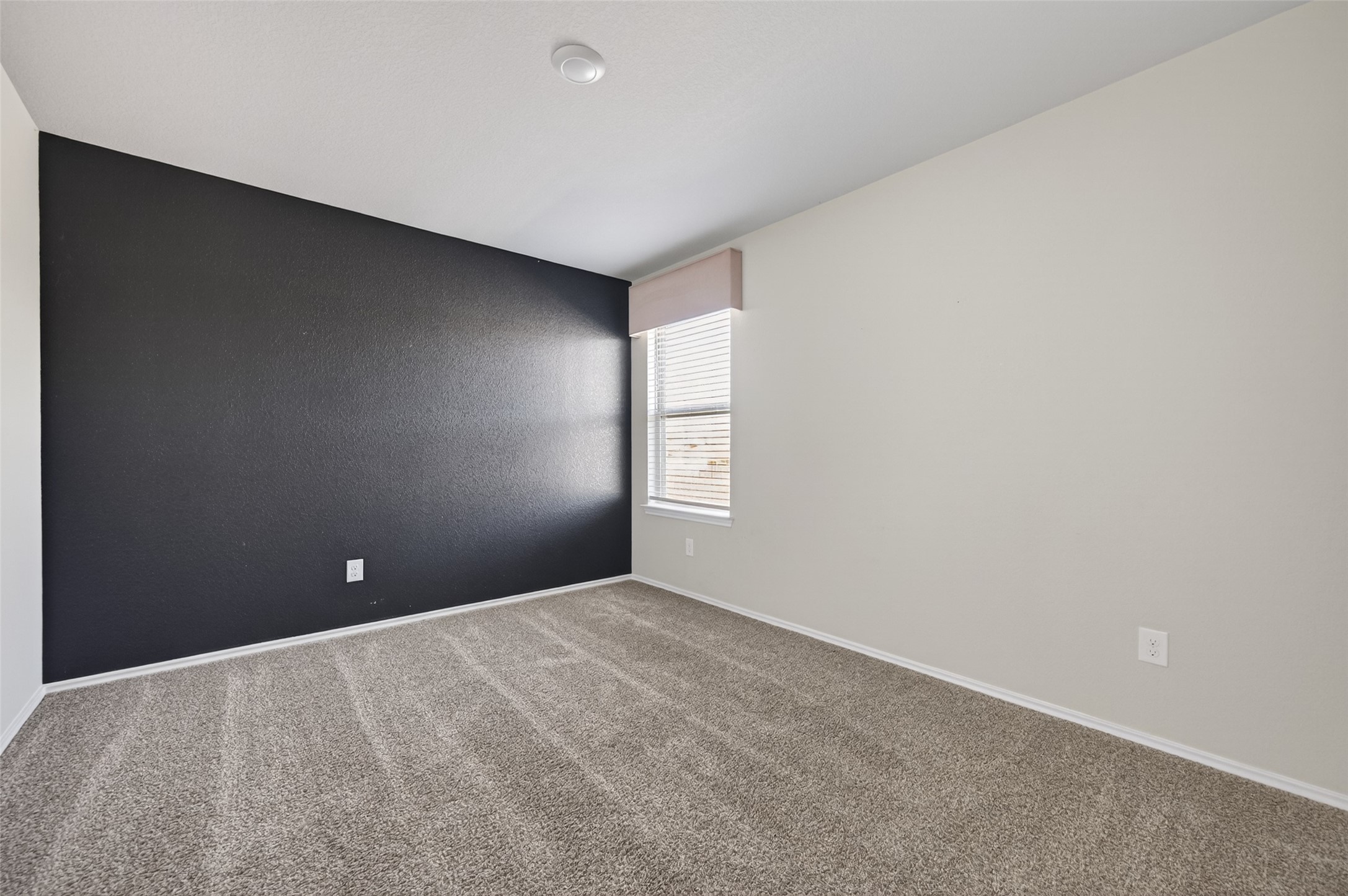 14432 Sugar Pines Drive Conroe, TX 77302 - Photo 20 of 26 a view of an empty room with a window
