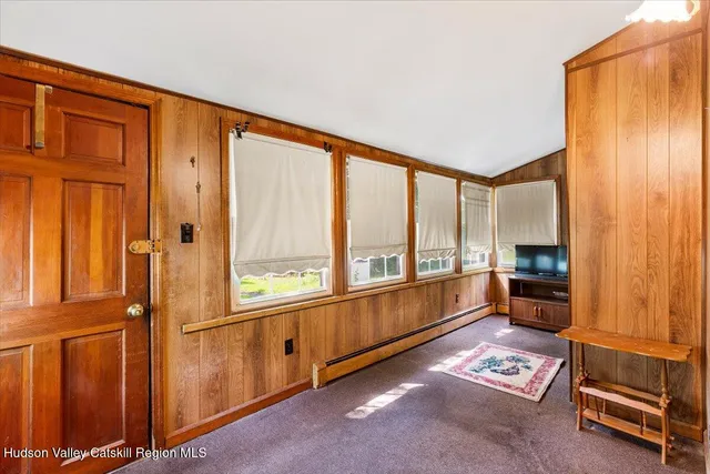 a view of workspace with furniture and windows