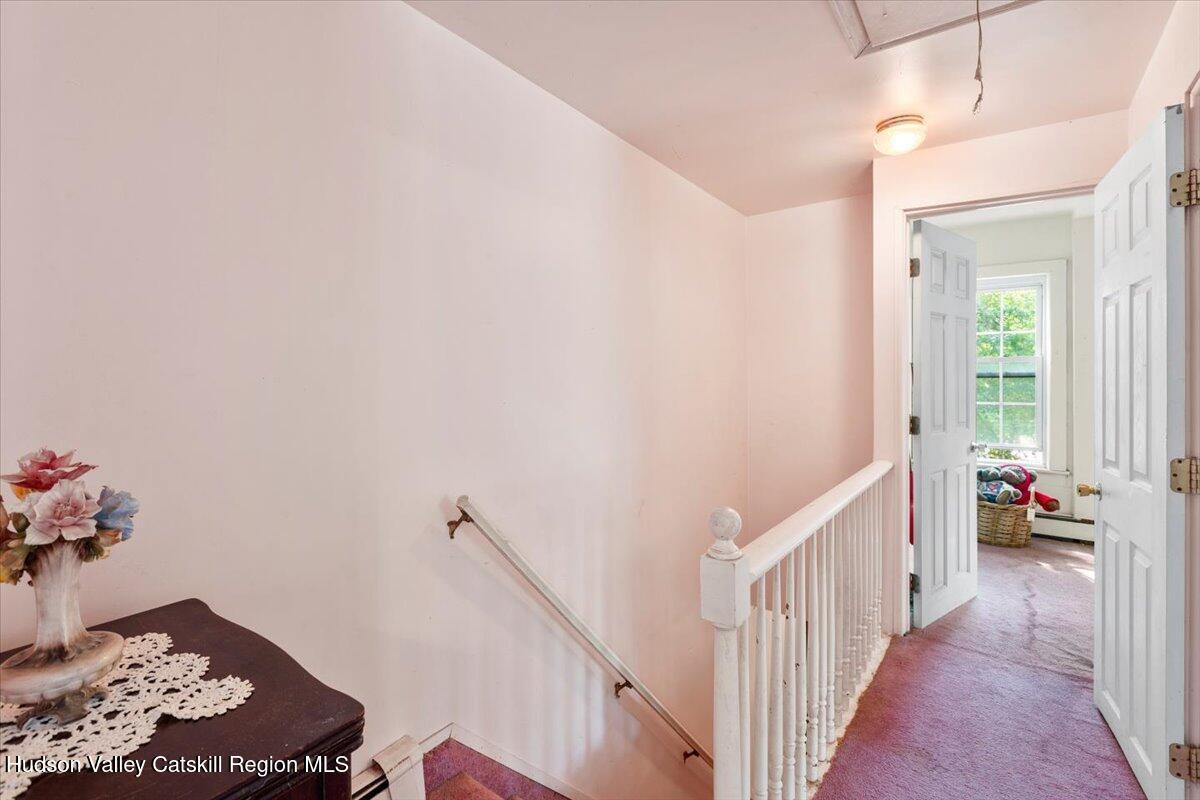 7 Grove Street Cairo, NY 12413 - Photo 16 of 35 a view of a hallway to room with wooden floor