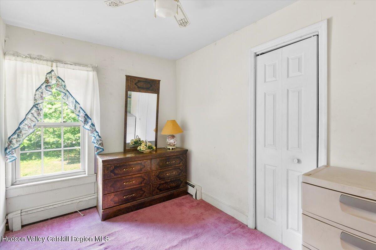 7 Grove Street Cairo, NY 12413 - Photo 19 of 35 a living room with a dresser and a window