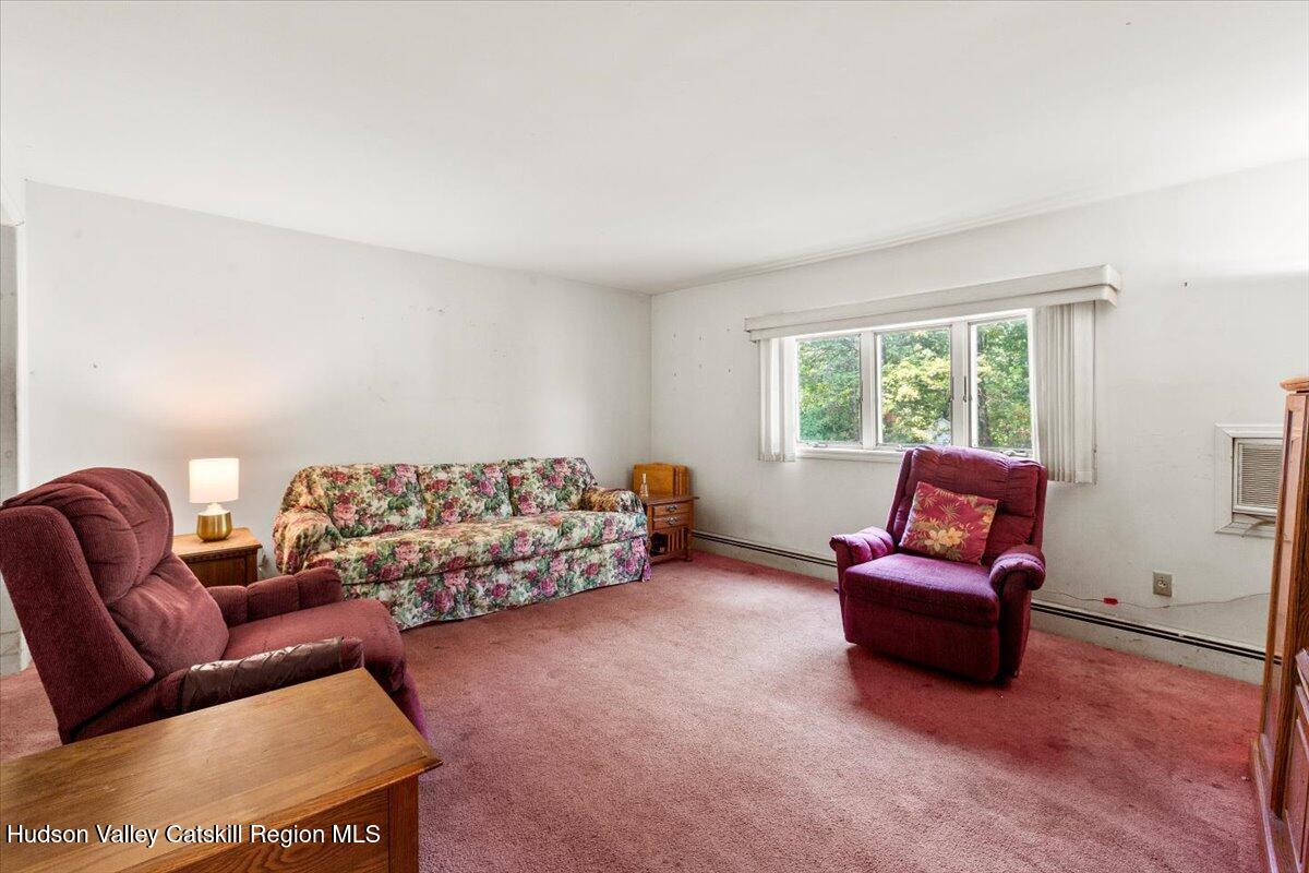 7 Grove Street Cairo, NY 12413 - Photo 2 of 35 a living room with furniture and a window