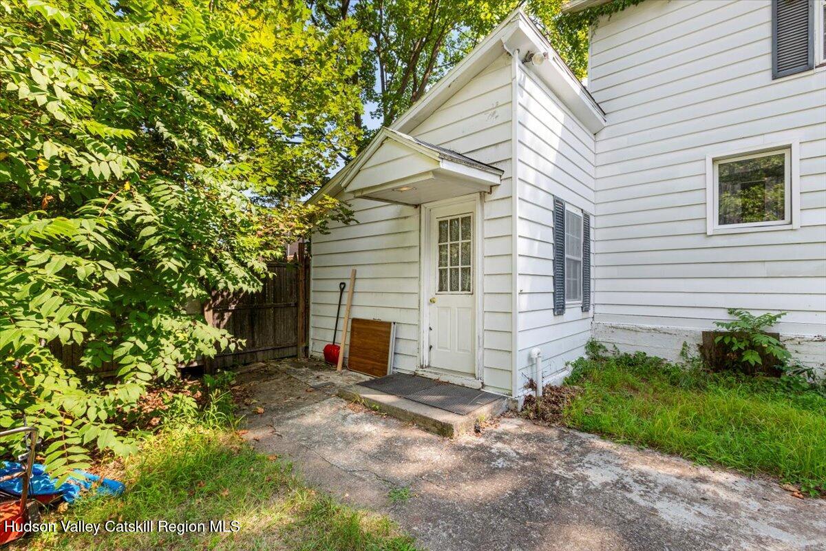 7 Grove Street Cairo, NY 12413 - Photo 25 of 35 a view of a white house with a yard and garage