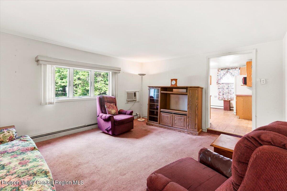 7 Grove Street Cairo, NY 12413 - Photo 3 of 35 a living room with furniture and a window