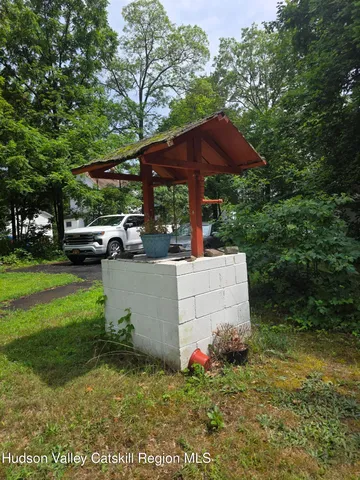 a view of a garden with an outdoor seating