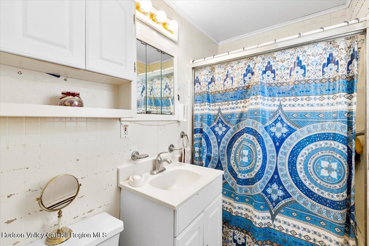 7 Grove Street Cairo, NY 12413 - Photo 10 of 35 a bathroom with a sink a washer and dryer