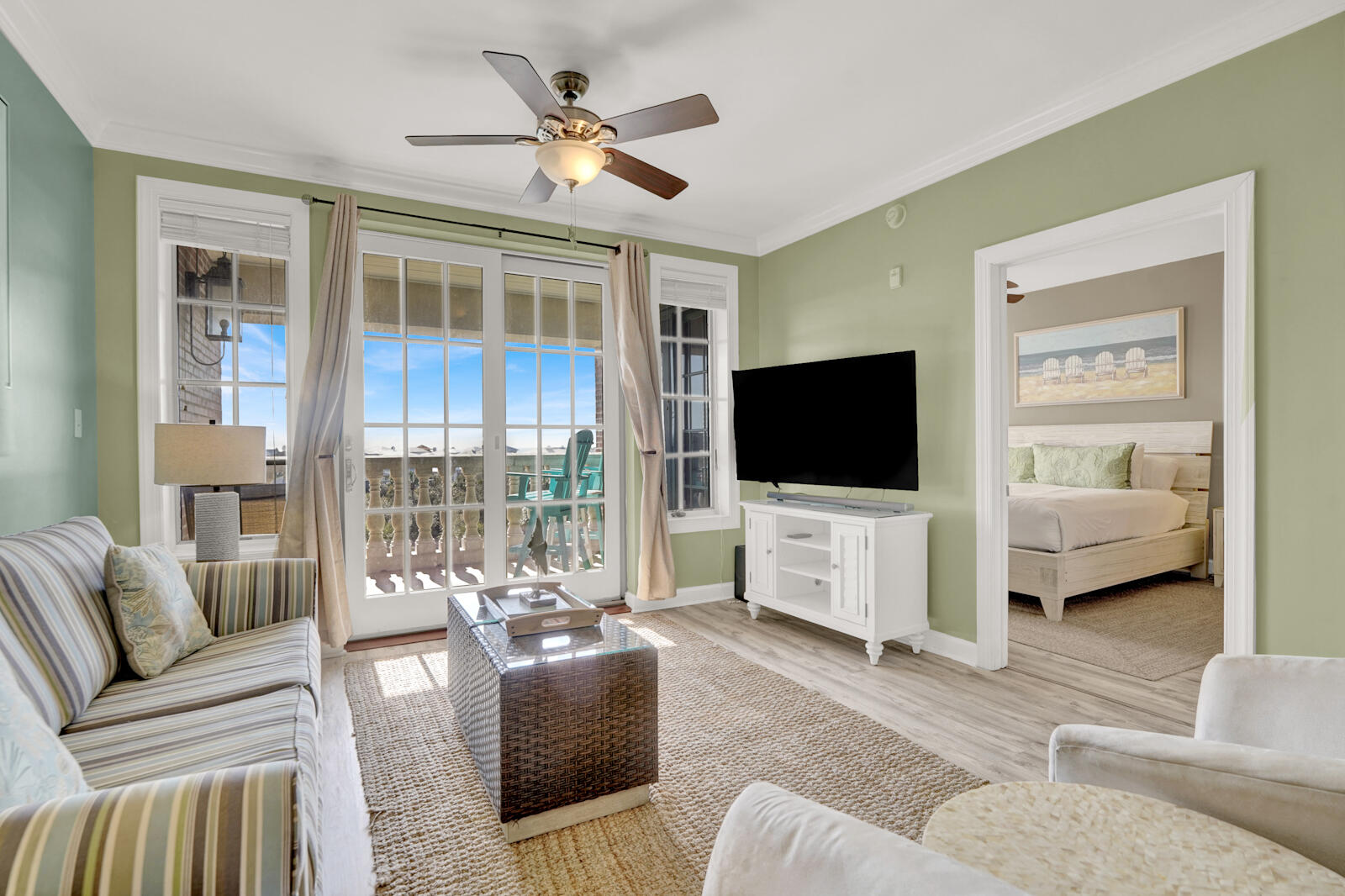 a living room with furniture and a flat screen tv