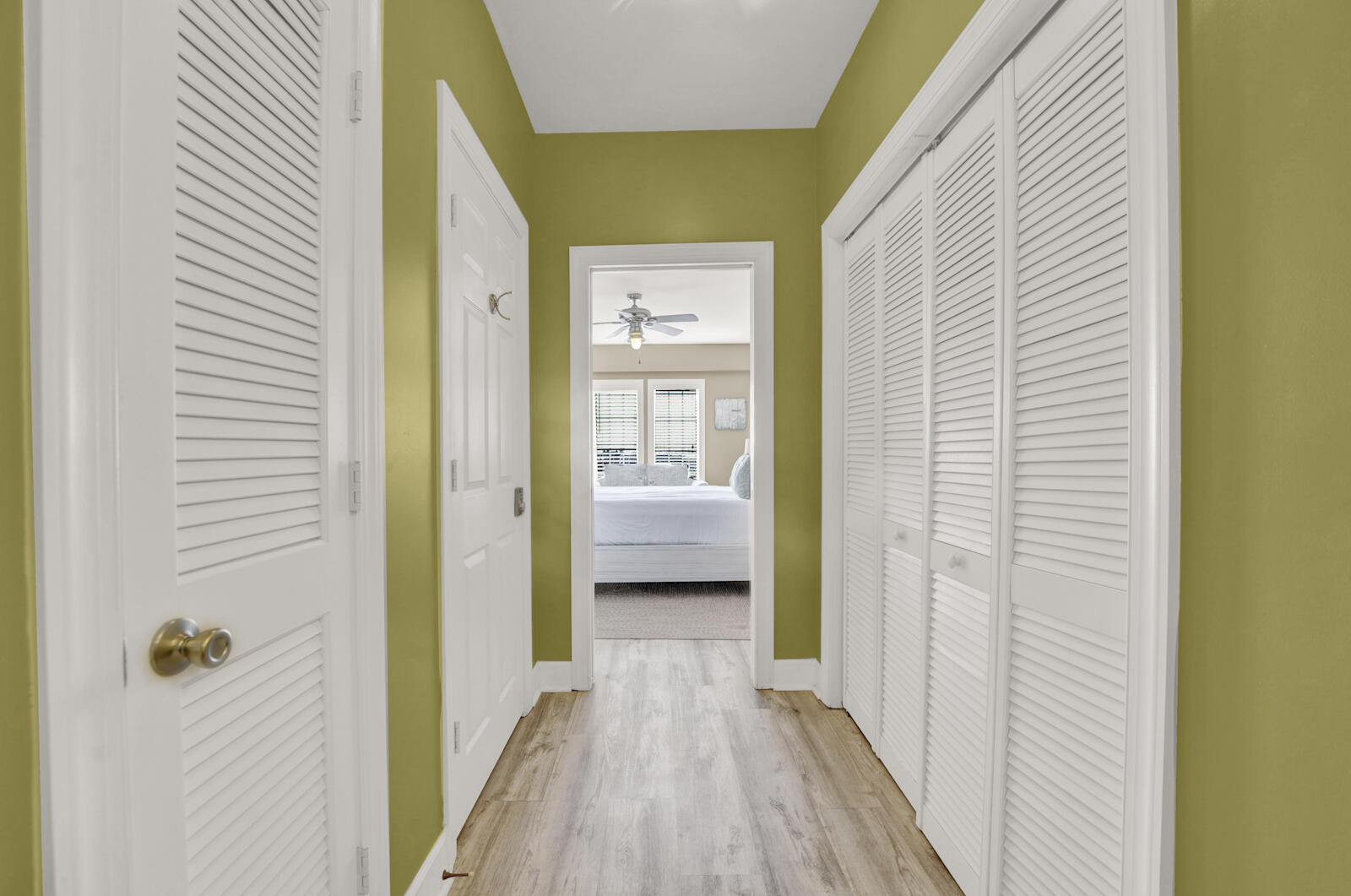 10343 East County Highway 30A, Unit 412B Seacrest, FL 32413 - Photo 23 of 39 a view of a hallway with wooden floor and a bedroom