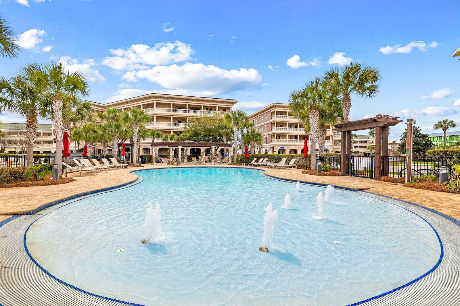 10343 East County Highway 30A, Unit 412B Seacrest, FL 32413 - Photo 29 of 39 a view of a swimming pool with a lawn chairs