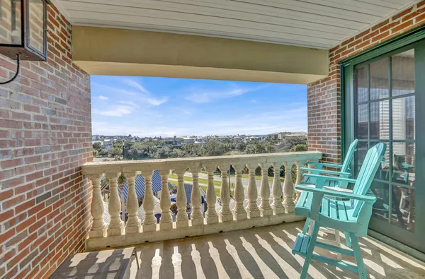 a balcony with wooden floor