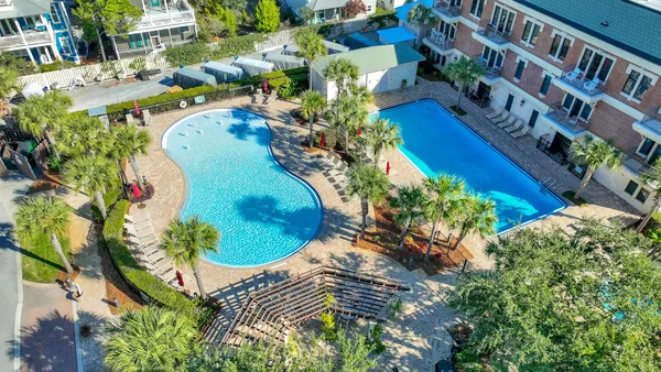 a view of a swimming pool with a yard
