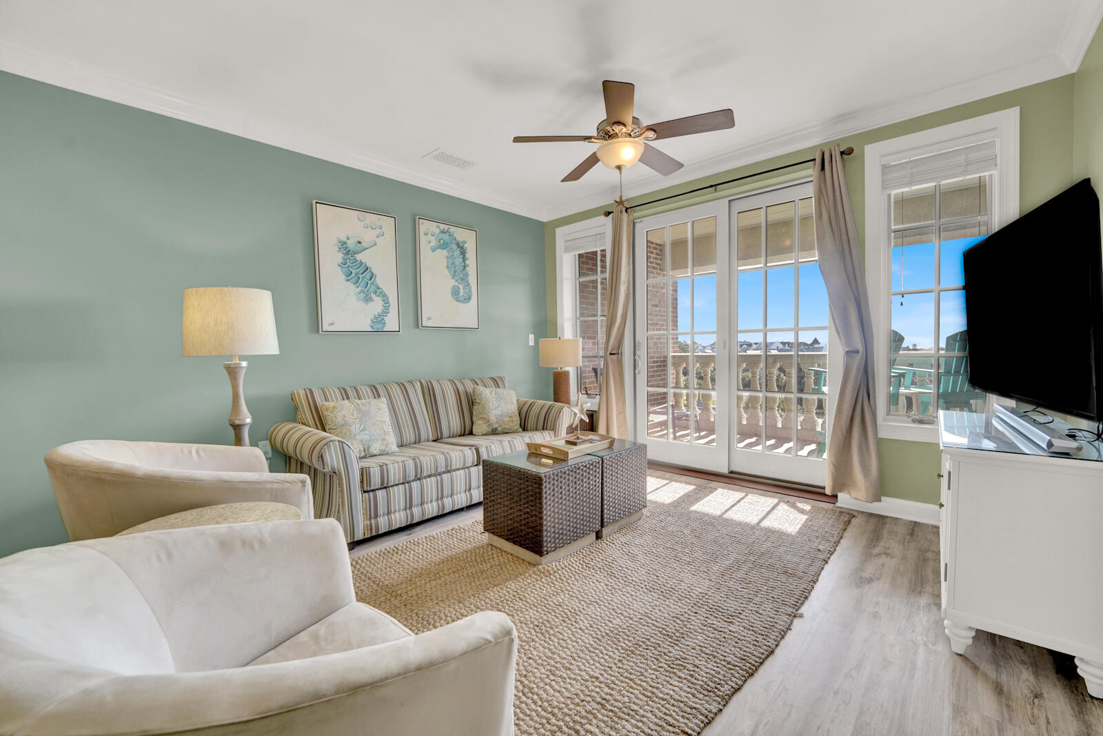 10343 East County Highway 30A, Unit 412B Seacrest, FL 32413 - Photo 4 of 39 a living room with furniture and a flat screen tv
