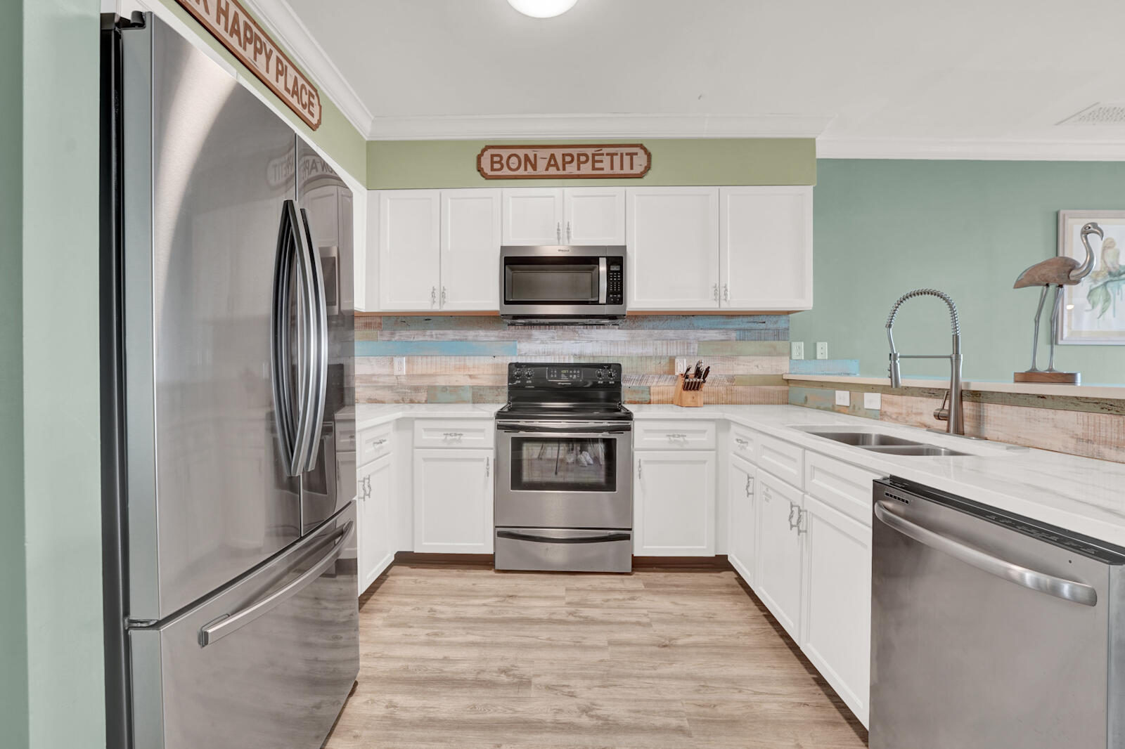 10343 East County Highway 30A, Unit 412B Seacrest, FL 32413 - Photo 6 of 39 a kitchen with stainless steel appliances granite countertop a refrigerator and a stove top oven