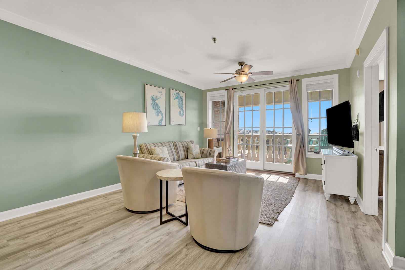10343 East County Highway 30A, Unit 412B Seacrest, FL 32413 - Photo 8 of 39 a living room with a couch and a flat screen tv