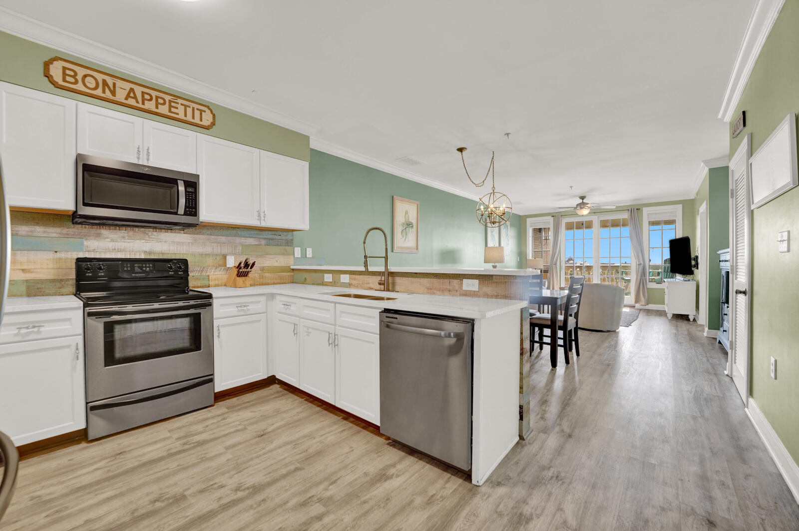 10343 East County Highway 30A, Unit 412B Seacrest, FL 32413 - Photo 9 of 39 a kitchen with a sink cabinets and wooden floor
