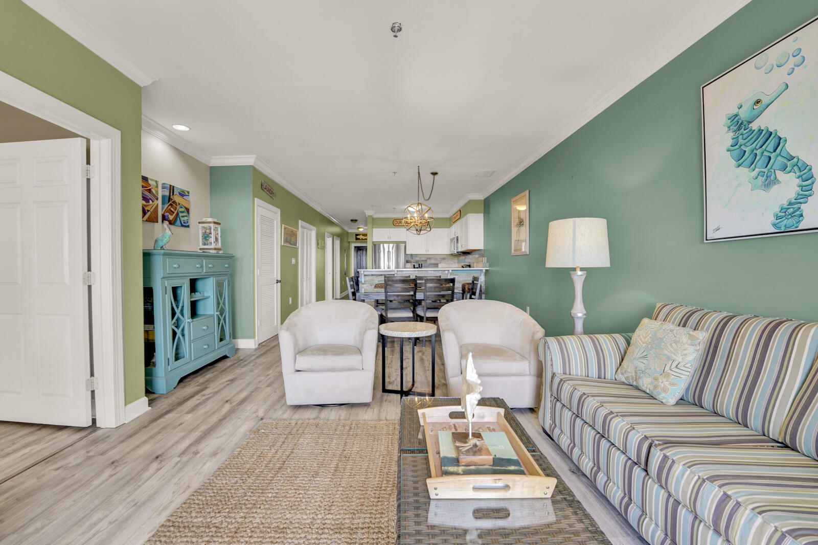 10343 East County Highway 30A, Unit 412B Seacrest, FL 32413 - Photo 10 of 39 a living room with furniture and a chandelier