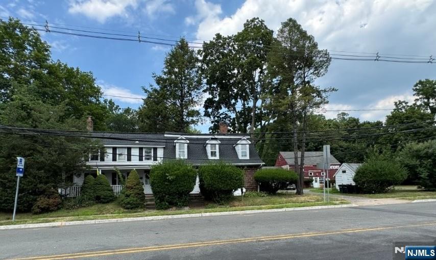 795 East Glen Avenue Ridgewood, NJ 07450 - Photo 3 of 5 a front view of a house with a garden