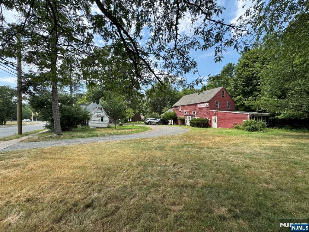 795 East Glen Avenue Ridgewood, NJ 07450 - Photo 5 of 5 a front view of a house with a yard and tree s