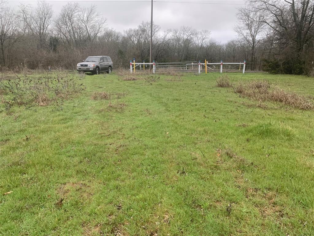 10843 East Line Road Trenton, TX 75490 - Photo 13 of 19 a backyard of a house with lots of green space
