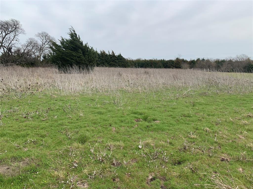 10843 East Line Road Trenton, TX 75490 - Photo 3 of 19 a view of a lake with houses in the back