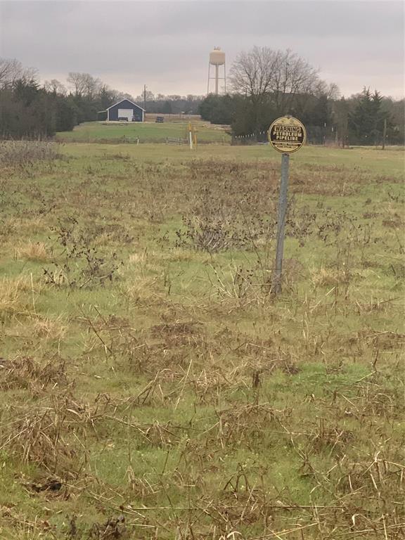 10843 East Line Road Trenton, TX 75490 - Photo 10 of 19 a view of a lake with a dry yard in the back