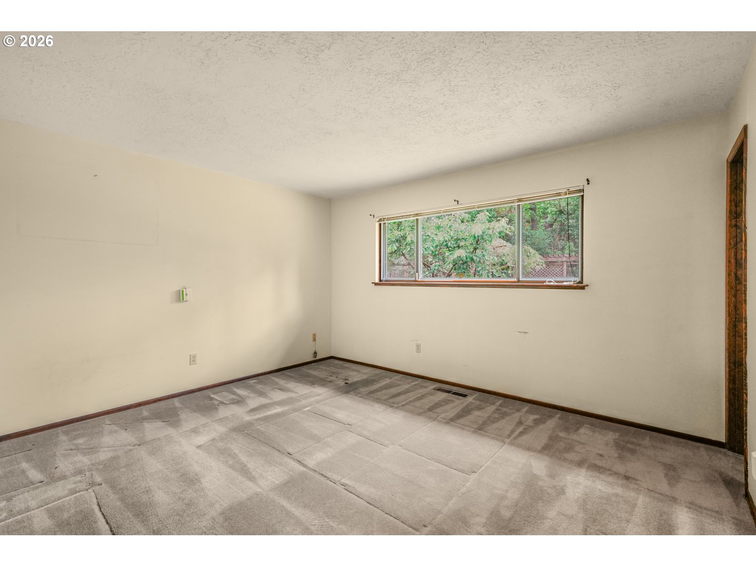 14155 Southwest 27th Street Beaverton, OR 97008 - Photo 18 of 27 an empty room with windows