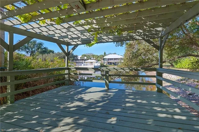 a view of a lake with a house in the background