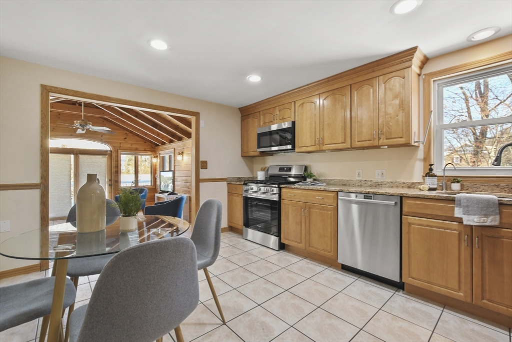 2 Market Street Billerica, MA 01821 - Photo 11 of 34 a kitchen with microwave a stove and furniture