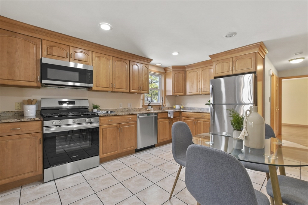 2 Market Street Billerica, MA 01821 - Photo 12 of 34 a kitchen with stainless steel appliances granite countertop a refrigerator sink and cabinets