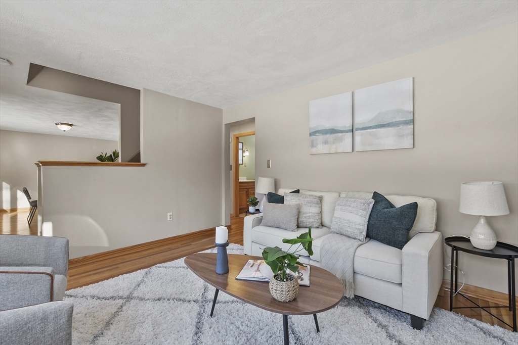 2 Market Street Billerica, MA 01821 - Photo 15 of 34 a living room with furniture and wooden floor