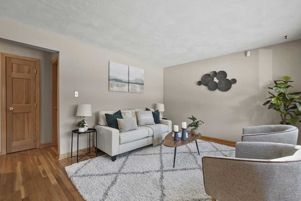 2 Market Street Billerica, MA 01821 - Photo 18 of 34 a living room with furniture and a potted plant