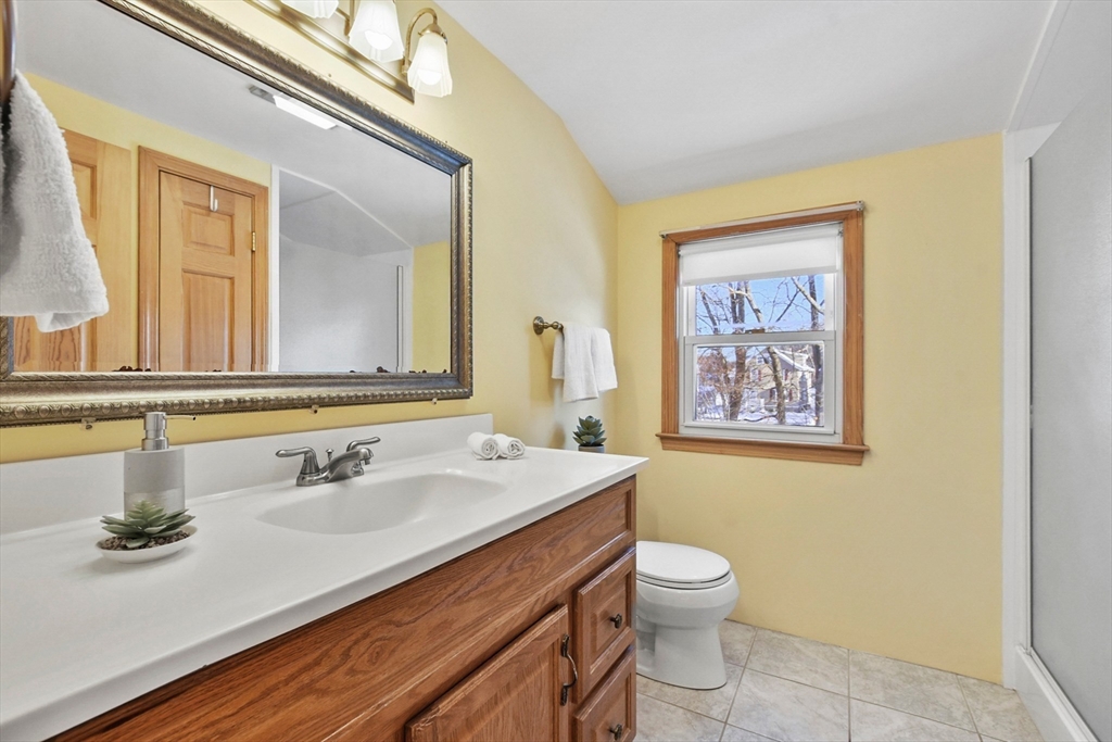 2 Market Street Billerica, MA 01821 - Photo 28 of 34 a bathroom with a sink a toilet and mirror