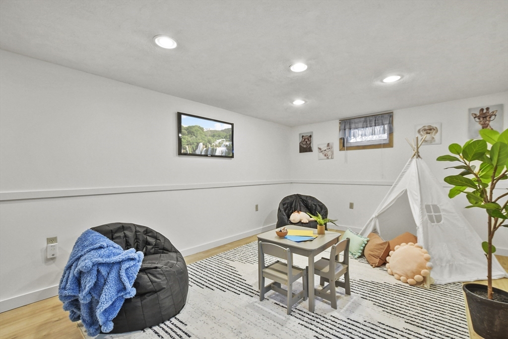 2 Market Street Billerica, MA 01821 - Photo 29 of 34 a bed room with furniture and a potted plant