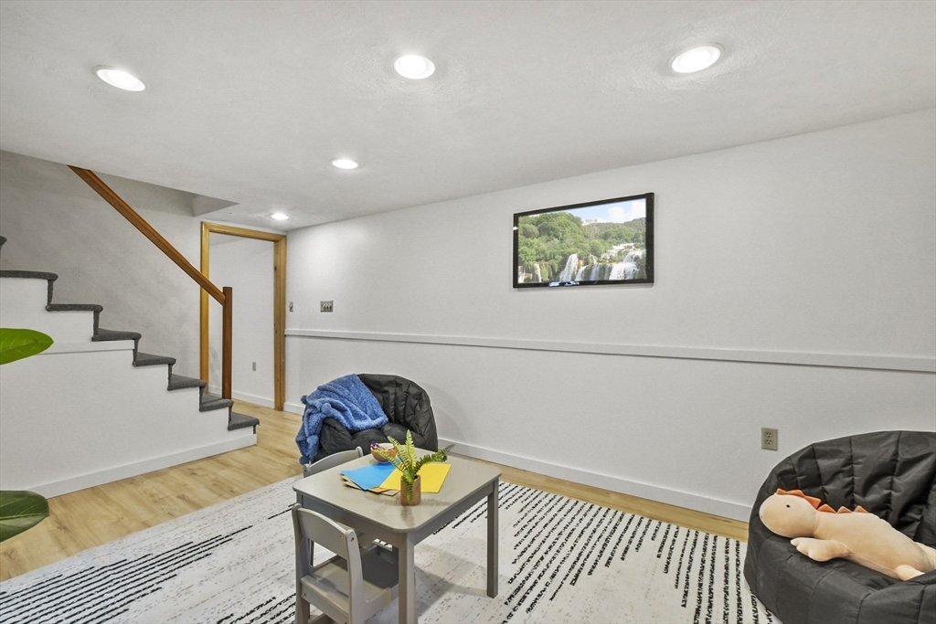 2 Market Street Billerica, MA 01821 - Photo 30 of 34 a living room with furniture and a rug
