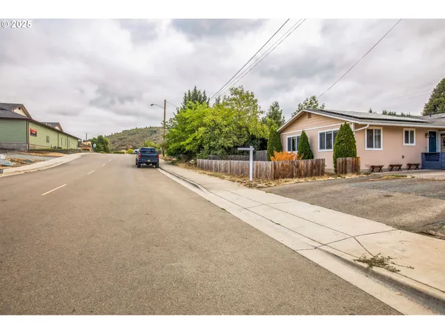 a view of a house with a street