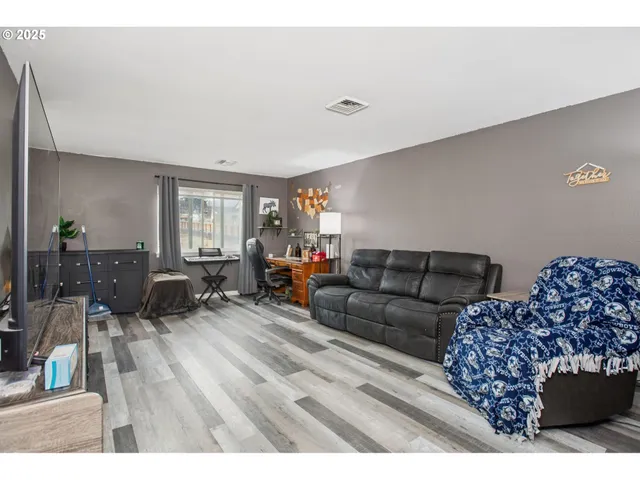 a living room with furniture and a couch