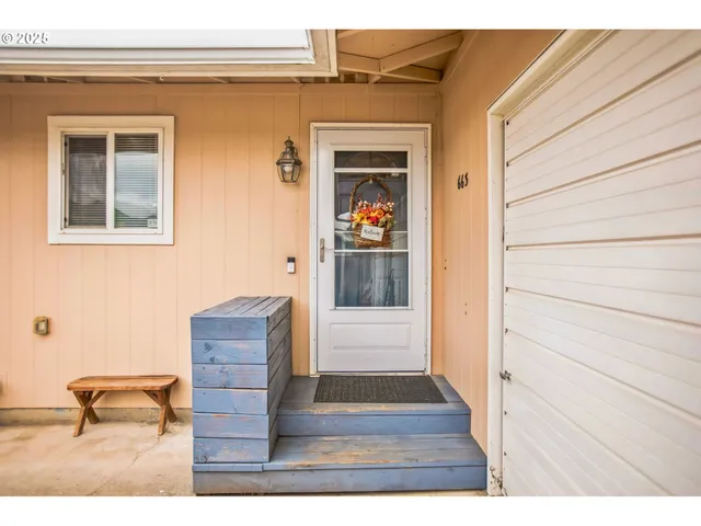 a view of living room and wooden floor