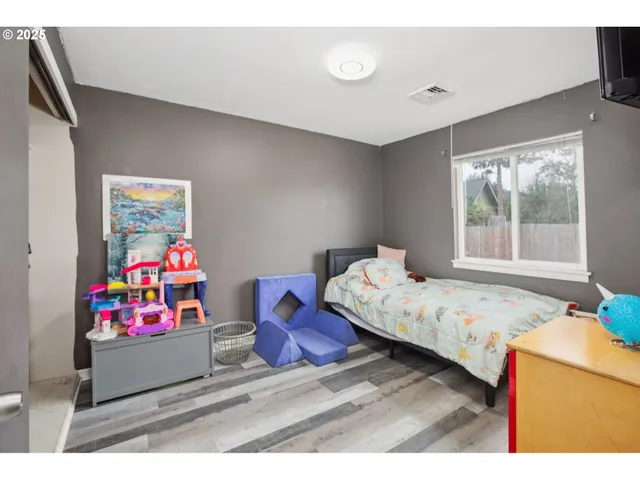 a bedroom with furniture and a bed