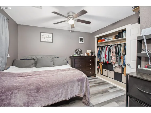 a bedroom with a bed and dresser