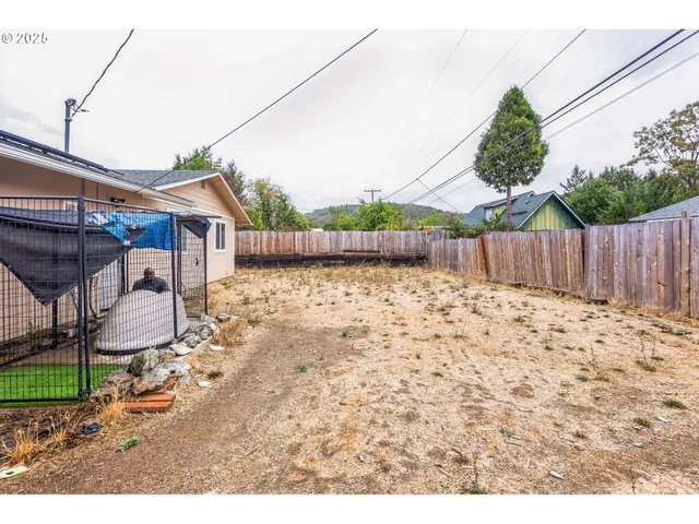 a view of a backyard with a small cabin