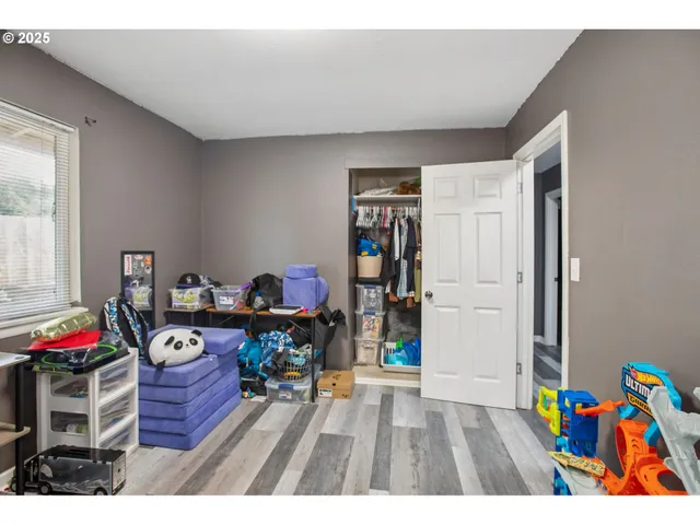 a view of an entryway with wooden floor