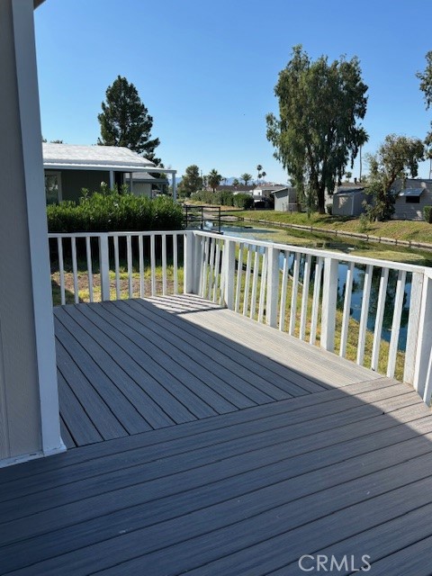 578 Channel Way Needles, CA 92363 - Photo 3 of 20 a view of balcony with wooden floor and fence
